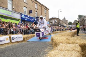 BBC Radio Lancashire’s Graham Liver and Sharon Hartley racing in the Amazing Accrington Soapbox Challenge